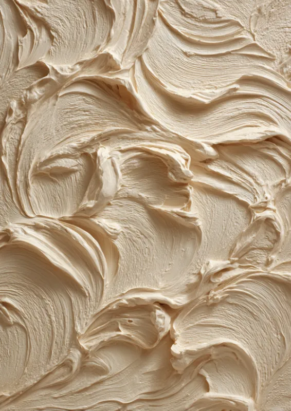 Close-up of thick swirling cream brushstrokes sweeping in organic curves creating a sculptural textured surface