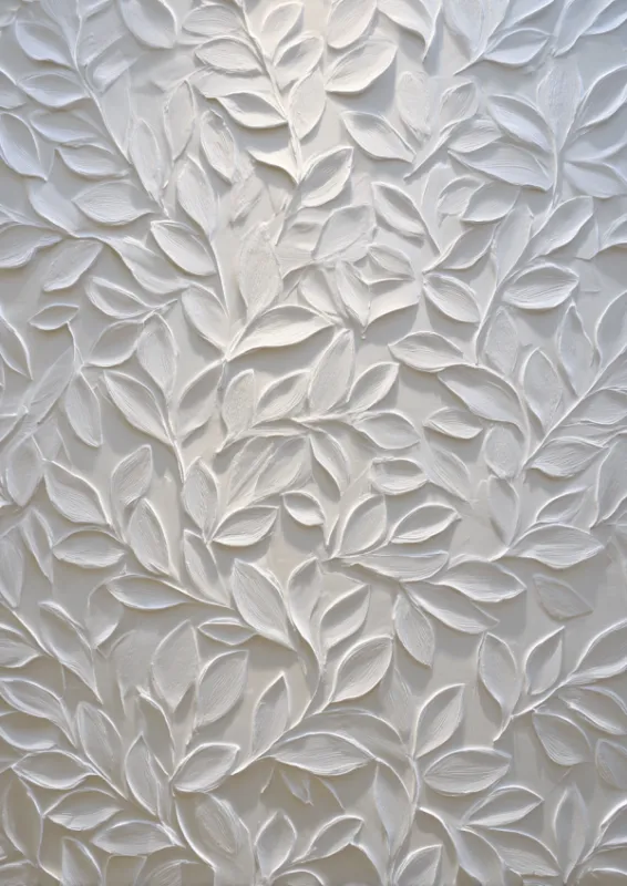 All-white sculptural canvas covered in delicately raised leaf motifs in relief creating depth and shadow